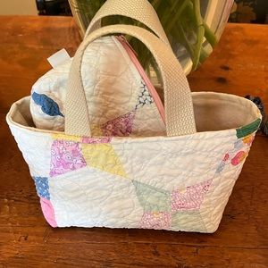 Cute purse made from vintage quilt. Includes matching zippered pouch.